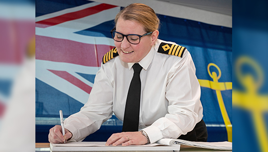 Image:Captain Susan Cloggie-Holden enters her name in the log of the replenishment ship which is designed to provide the ships of the Royal Navy, and especially its carrier battle groups, with fuel to sustain global operations.  Image: Crown copyright