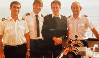 Image:Capt Roberts onboard with crew during his time at sea. Soon after passing his masters certificate in 1971, he began working on ferries in Dover.
