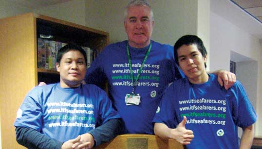 Image:Nautilus ITF ship inspector Tommy Molloy in pre-lockdown times with some seafarers he has helped from the Grain Exress.