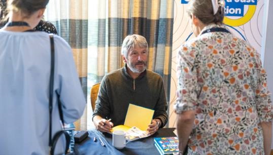 Former Nautilus Telegraph editor Andrew Linington, author of Pulling Together, signs books for members at the launch during the General Meeting in 2023. Image: Brad Wakefield Image:Former Nautilus Telegraph editor Andrew Linington, author of Pulling Together, signs books for members at the launch during the General Meeting in 2023. Image: Brad Wakefield