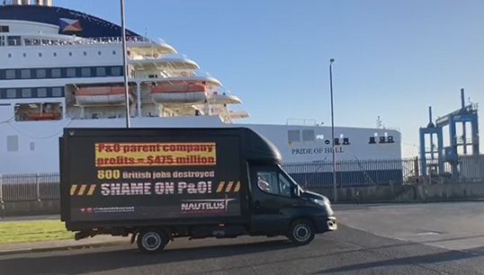 Image:The Nautilus campaign van with the P&O Ferries vessel Pride of Hull in one of two previous protests that had taken place before the ship slipped away to Rotterdam under cover of darkness on 23/24 March 