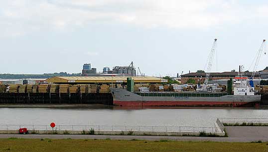 Image:A Scotline timber vessel unloading in the Medway in the UK. Image:Wikimedia Commons