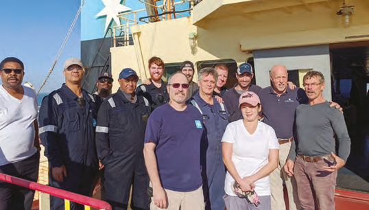 Maersk Montana crew with the rescued sailor. (Front row, left to right) Third mate Steven
Miller; Claribel Cabral, SA; (second row) James Cameron, chief steward; Sunnil Motley, bosun;
Fethanegest Demoz, AB; Eddie Almodovar, electrician; chief mate Forrest Halley; Captain
Richard Hoey; Miki Chumachenkov (survivor); (third row) George Phillips, AB; Blaine
McDonough, cadet; Brett Starr, cadet; chief engineer Jeremy Travers. Image: Maersk Montana crew Image:Maersk Montana crew with the rescued sailor. (Front row, left to right) Third mate Steven
Miller; Claribel Cabral, SA; (second row) James Cameron, chief steward; Sunnil Motley, bosun;
Fethanegest Demoz, AB; Eddie Almodovar, electrician; chief mate Forrest Halley; Captain
Richard Hoey; Miki Chumachenkov (survivor); (third row) George Phillips, AB; Blaine
McDonough, cadet; Brett Starr, cadet; chief engineer Jeremy Travers. Image: Maersk Montana crew