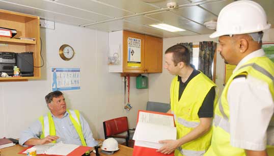 MCA officer and ship inspector checking a ship's compliance with safety standards in the Port of Southampton. Image: Crozet M/ ILO photo library Image:MCA officer and ship inspector checking a ship's compliance with safety standards in the Port of Southampton. Image: Crozet M/ ILO photo library