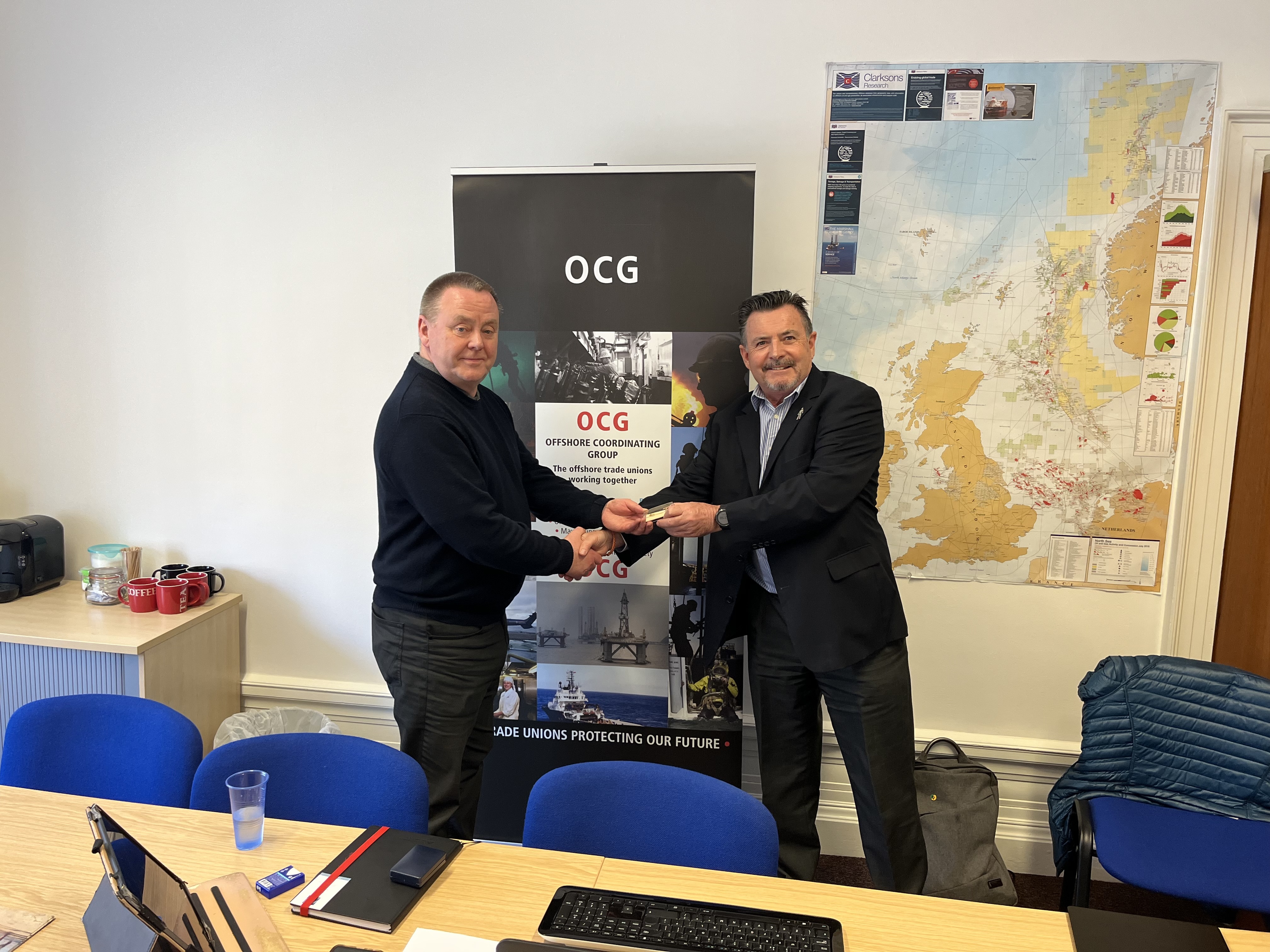 Image:Jake Molloy, left, was presented with a memento by Nautilus national organiser Steve Doran.