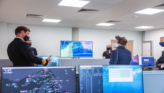 RAdm Andrew Burns discussing platform enabled training capability. Image: QinetiQ Image:RAdm Andrew Burns discussing platform enabled training capability. Image: QinetiQ