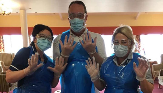 Jane Davies, right, with welfare team members Emma Cooke RGN and Paul Gorman during Covid-19 swab testing. Image:Jane Davies, right, with welfare team members Emma Cooke RGN and Paul Gorman during Covid-19 swab testing.