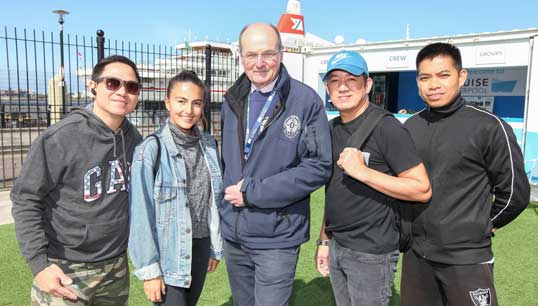 Image:Liverpool Seafarers Centre (LSC) CEO John Wilson (middle)  with some crew from the MS Black Watch at the seafarer centre near the Liverpool cruise line terminal. Image: LSC
