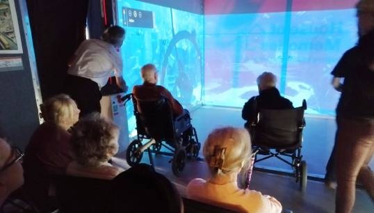 Image:Residents browse through a 'House of Memories' – a portable museum set up temporarily at Mariners' Park with the support of the National Museums Liverpool. Images: Nautilus Welfare Fund