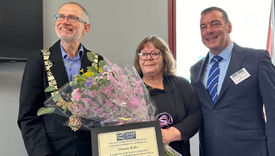 At the reopening ceremony, Donna Betts (middle) received recognition for 26 years of service to seafarer welfare in Felixstowe from QVSR CEO Alex Campbell (right) and the mayor of Felixstowe David Rowe. Image: QVSR
Image:At the reopening ceremony, Donna Betts (middle) received recognition for 26 years of service to seafarer welfare in Felixstowe from QVSR CEO Alex Campbell (right) and the mayor of Felixstowe David Rowe. Image: QVSR